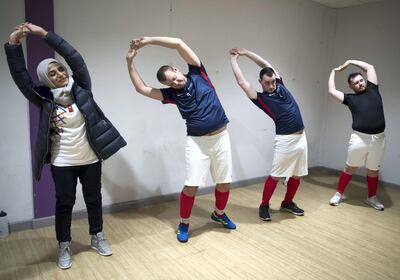 SHEFFIELD,UNITED KINGDOM. 19th January 2019. Rawdha Al Otaiba, Deputy Head of Mission at the UAE Embassy in London, takes part in stretching exercises with the  Special Olympics-GB Team during a training camp in Sheffield, United Kingdom, ahead of the Special Olympics World Games 2019 in Abu Dhabi. Stephen Lock for the National 