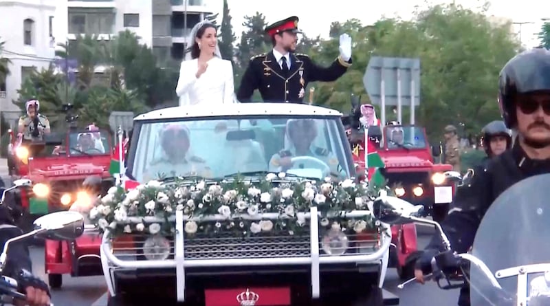 The convoy takes the newlyweds from their wedding to the grand reception at Al Husseiniya Palace. Reuters