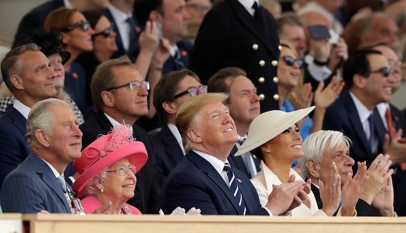 Britain's Prince Charles, Queen Elizabeth II, President Donald Trump, first lady Melania Trump and Greek President Prokopis Pavlopoulos, from left, applaud as they watch a fly past at the end of an event to mark the 75th anniversary of D-Day in Portsmouth, England Wednesday, June 5, 2019. World leaders including U.S. President Donald Trump are gathering Wednesday on the south coast of England to mark the 75th anniversary of the D-Day landings. (AP Photo/Matt Dunham)