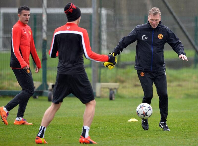 David Moyes trains with Robin van Persie on Tuesday as Manchester United prepare for Olympiakos in the Champions League on Wednesday. Paul Ellis / AFP / March 18, 2014