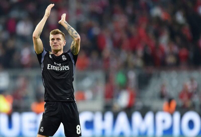 Real Madrid's German midfielder Toni Kroos celebrates after the Uefa Champions League first leg quarter-final football match FC Bayern Munich v Real Madrid in Munich, southen Germany on April 12, 2017. Christof Stache / AFP