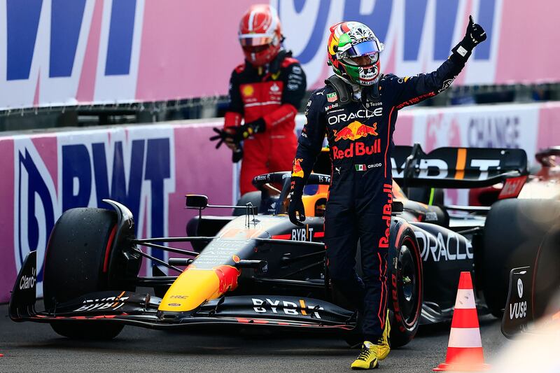 Red Bull Racing driver Sergio Perez gives the thumb up after obtaining fourth place in qualifying for the Mexico Grand Prix. AFP
