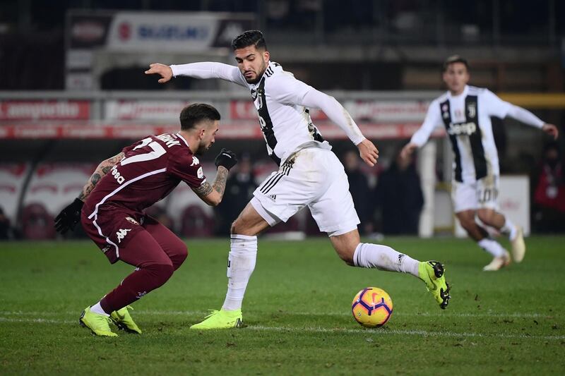 Juventus midfielder Emre Can takes on Torino midfielder Vittorio Parigini. AFP