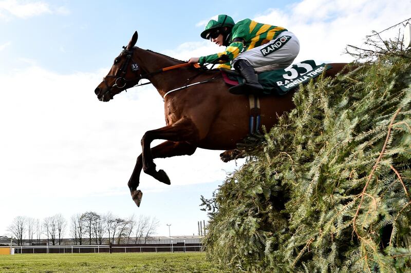Rachael Blackmore riding Minella Times clears the last fence to win the Randox Grand National at Aintree racecourse, near Liverpool, England. AP
