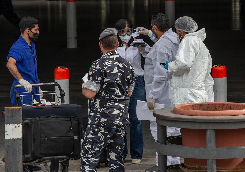 Lebanese nationals who were stranded abroad due to the coronavirus pandemic arrive from Cairo at Beirut international airport, Lebanon. EPA