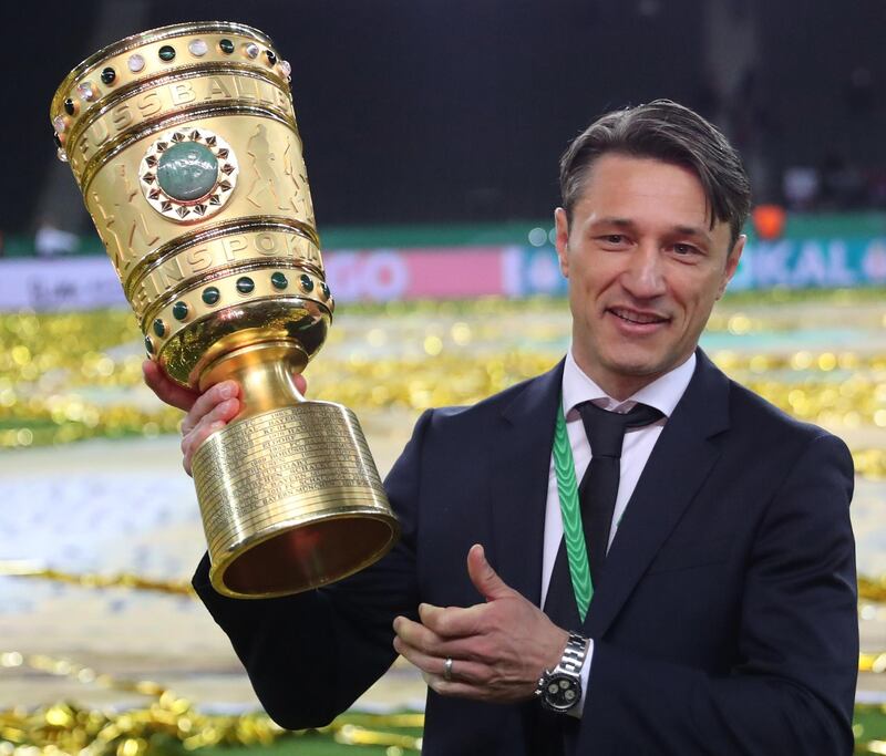 Bayern Munich's Croatian head coach Niko Kovac celebrates with the German Cup after Bayern beat RB Leipzig at the Olympic Stadium in Berlin. AFP