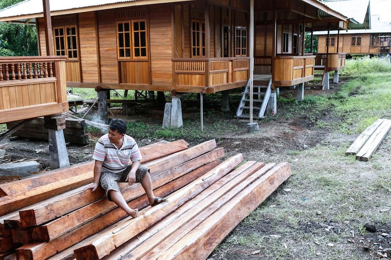 Buyers of Woloan houses have to shoulder the costs for transportation and customs fees, as well as travel costs of carpenters who will reinstall the house at site. Putu Sayoga / Getty Images