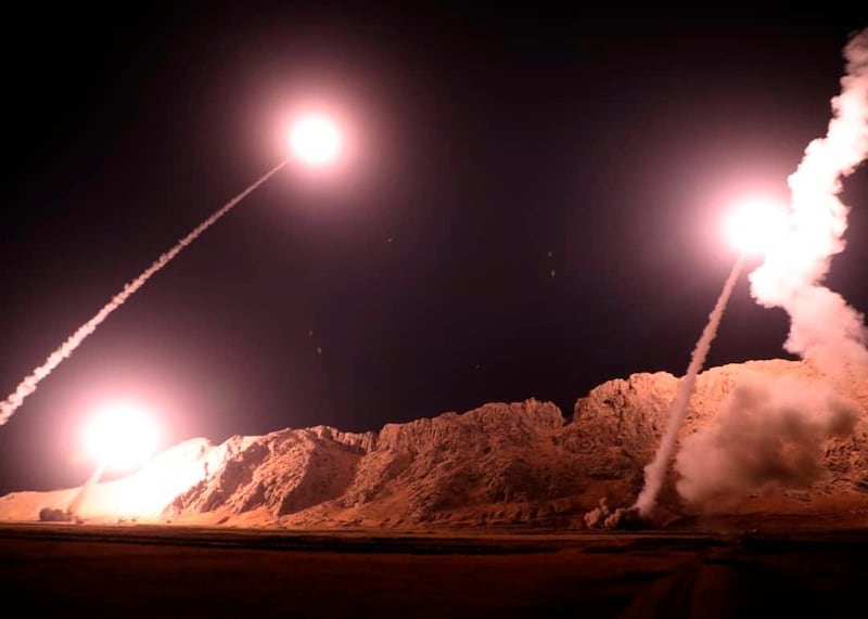 In this photo released on Monday, Oct. 1, 2018, by the Iranian Revolutionary Guard, missiles are fired from city of Kermanshah in western Iran targeting the Islamic State group in Syria. Iran's paramilitary Revolutionary Guard said Monday it launched ballistic missiles into eastern Syria targeting militants it blamed for a recent attack on a military parade. (Sepahnews via AP)