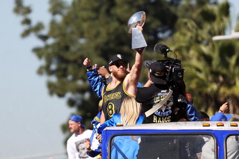 Los Angeles Rams player Cooper Kupp holds the Vince Lombardi Trophy during the parade. Reuters