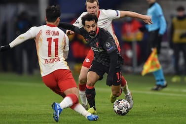 Liverpool's Egyptian midfielder Mohamed Salah (C) and Leipzig's Korean forward Hwang Hee-chan (L) vie for the ball. AFP