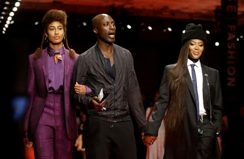 Fashion Designer Oswald Boateng, centre, Naomi Campbell, right. AP