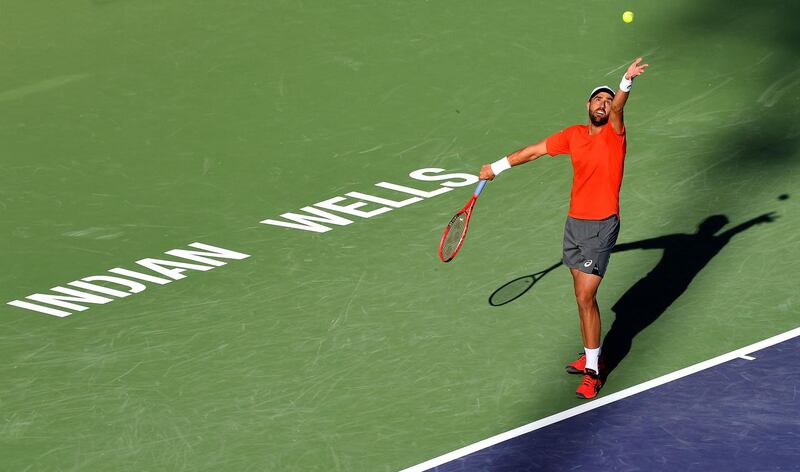Steve Johnson serves during his first-round match against fellow American Taylor Fritz at Indian Wells. Reuters
