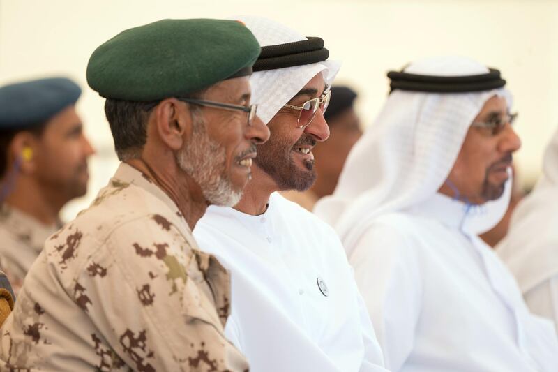 AL DHAFRA REGION, ABU DHABI, UNITED ARAB EMIRATES - April 08, 2018: HH Sheikh Mohamed bin Zayed Al Nahyan Crown Prince of Abu Dhabi Deputy Supreme Commander of the UAE Armed Forces (2nd L) and HE Lt General Hamad Thani Al Romaithi, Chief of Staff UAE Armed Forces (L) witness a military exercise titled ‘Homat Al Watan 2 (Protectors of the Nation)’, at Al Hamra Camp.
 ( Mohamed Al Hammadi / Crown Prince Court - Abu Dhabi )
---