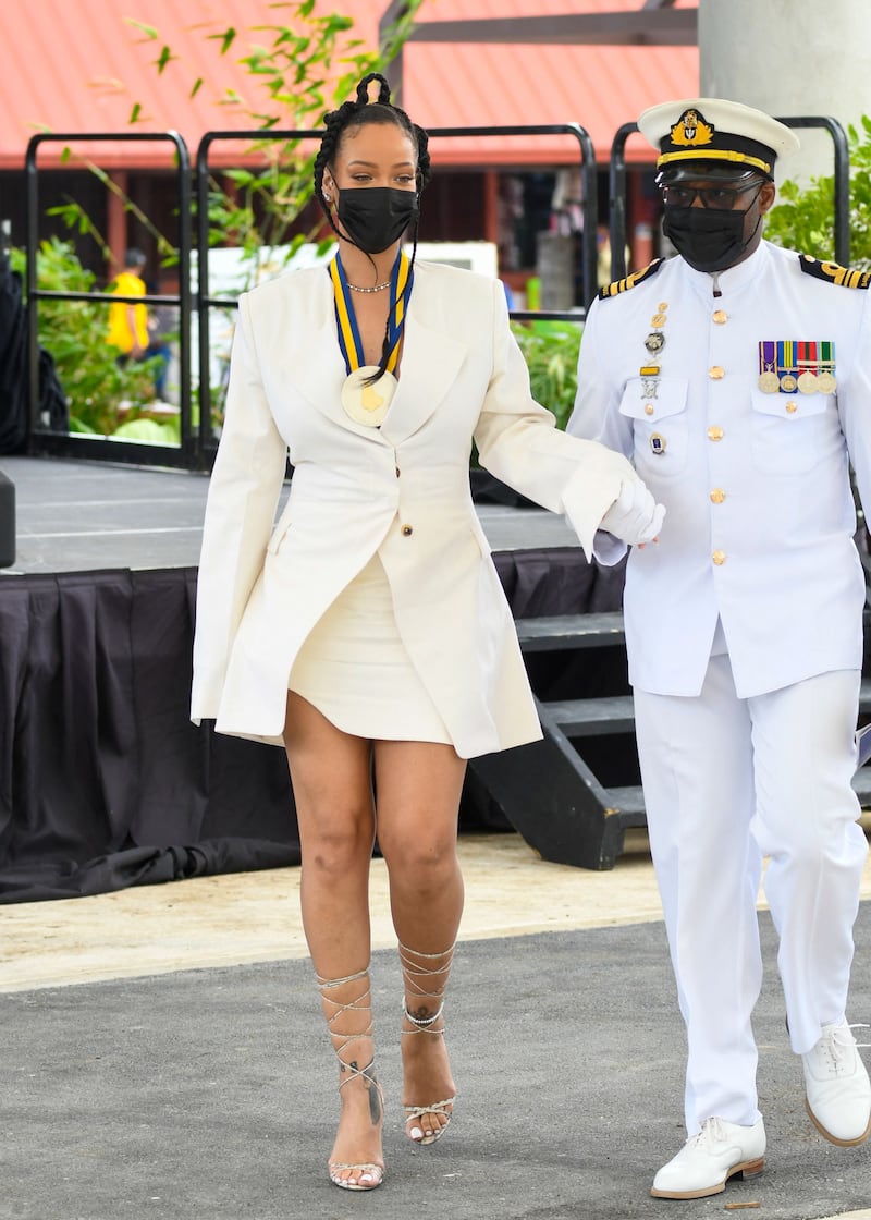 Rihanna, in a short white Maximilian blazer and dress, attends Barbados's National Honours ceremony and Independence Day Parade in Bridgetown, Barbados, on November 30, 2021.  AFP