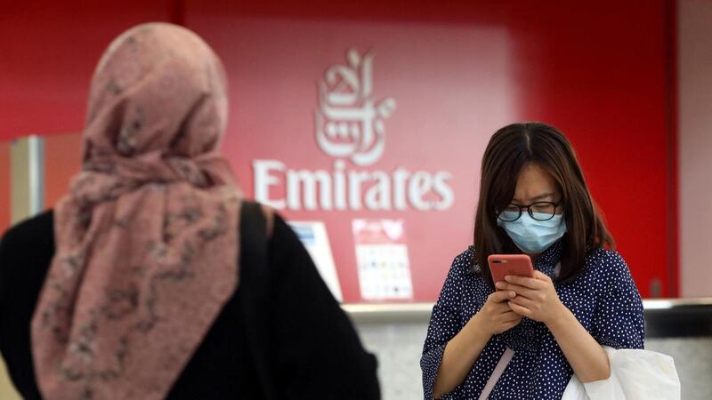 A traveller wears a mask at Dubai International Airport. Reuters