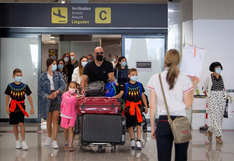 Tourists arrive at Son Sant Joan airport in Palma de Mallorca. AFP