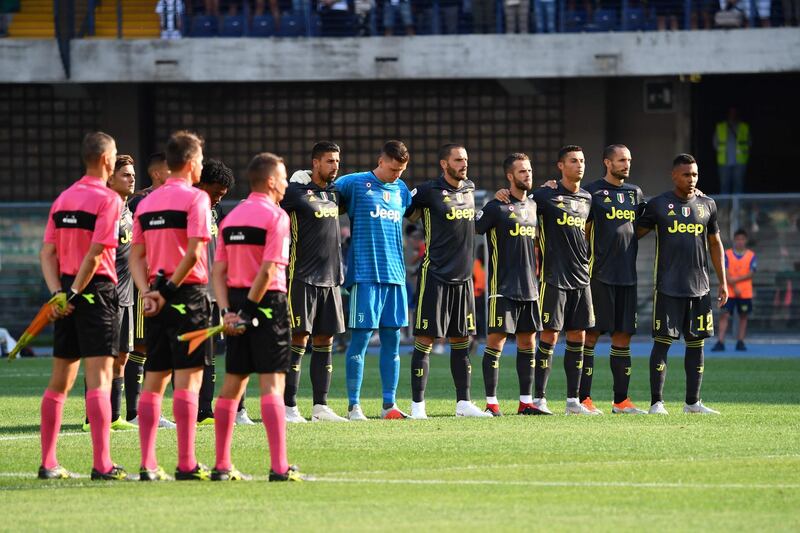 Juventus players stand for a minute of silence for the victims of Genoa's Morandi Bridge collapse.  AFP