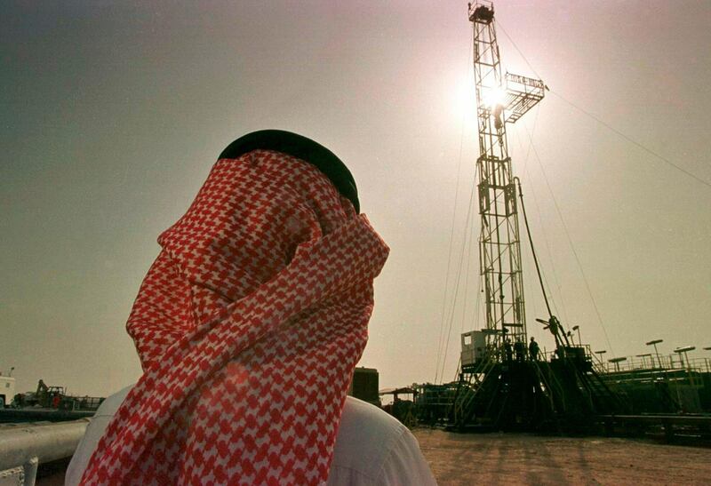 FILE - In this Feb. 26, 1997 file photo, Khaled al-Otaiby, an official of the Saudi oil company Aramco, watches progress at a rig at the al-Howta oil field near Howta, Saudi Arabia. According to an assessment published Monday, April 1, 2019, by Moodyâ€™s Investors Services, the net profits of Saudi Aramco reached $111 billion last year. That places Aramco ahead of some of the worldâ€™s most profitable firms. In their first-ever grade assessment for Aramco, Fitch Ratings issued the firm an A+ rating, while Moodyâ€™s gave it itâ€™s A1 rating ahead of its upcoming bonds sale. (AP Photo/John Moore, File)