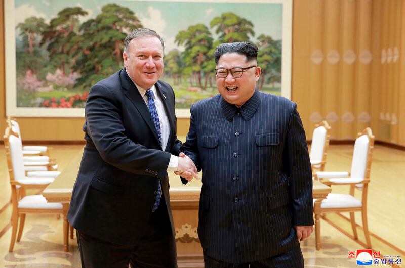 FILE - In this May 9, 2018, file photo provided by the North Korean government, U.S. Secretary of State Mike Pompeo, left, shakes hands with North Korean leader Kim Jong Un during a meeting at Workers' Party of Korea headquarters in Pyongyang, North Korea. North Korea warned Washington through its state media Tuesday, Oct. 2, that a declaration ending the Korean War shouldn't be seen as a bargaining chip in denuclearization talks â€” but suggested lifting sanctions might be. Independent journalists were not given access to cover the event depicted in this image distributed by the North Korean government. The content of this image is as provided and cannot be independently verified. Korean language watermark on image as provided by source reads: "KCNA" which is the abbreviation for Korean Central News Agency. (Korean Central News Agency/Korea News Service via AP, File)