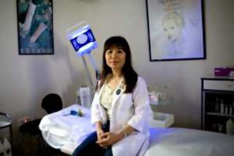 Abu Dhabi - July 16, 2008:  Parisa Askari, owner of Pariska Beauty Center in Abu Dhabi poses with the "Ionto", her favorite "beauty concepty machine" which she uses for facials. Lauren Lancaster / The National  *** Local Caption ***  LL_ParisaAskari001.jpg