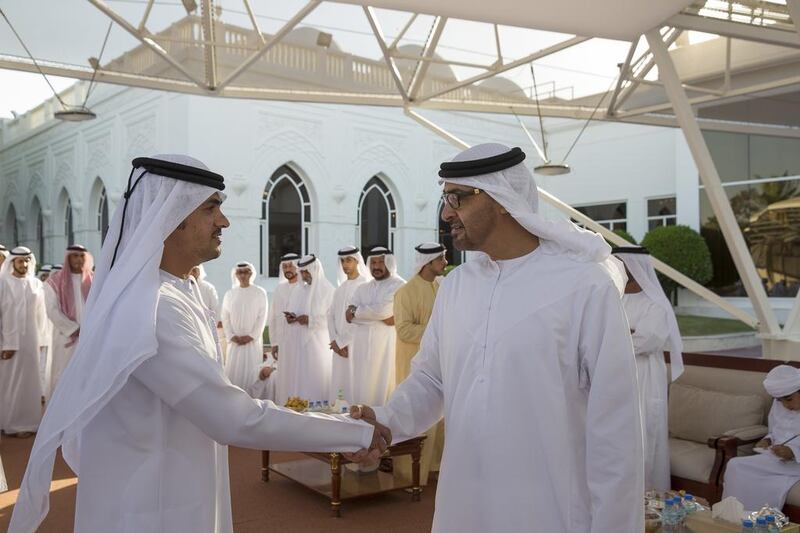 Sheikh Mohammed bin Zayed, Crown Prince of Abu Dhabi Deputy Supreme Commander of the Armed Forces, receives a serviceman injured in Yemen, during a Sea Palace barza. Mohamed Al Hammadi / Crown Prince Court - Abu Dhabi