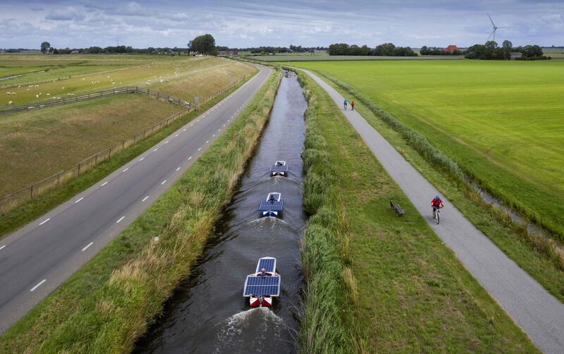 An aerial picture shows students sailing with solar boats along all Frisian Elfstedentocht (Eleven Cities Races) during the Young Solar Challenge in Hindeloopen.  The 220-kilometre journey must be completely solar-powered in five days. AFP