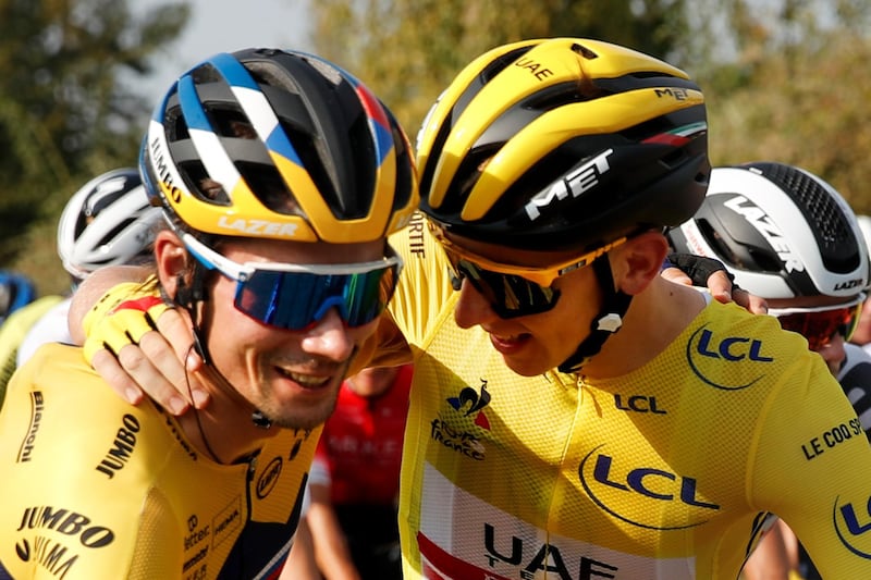 Slovenia's Primoz Roglic, left, who lost his overall leader's yellow jersey to Slovenia's Tadej Pogacar, right, gets a hug during the twenty-first and last stage of the Tour de France cycling race over 122 kilometers (75.8 miles), from Mantes-La-Jolie to Paris, France. AP Photo