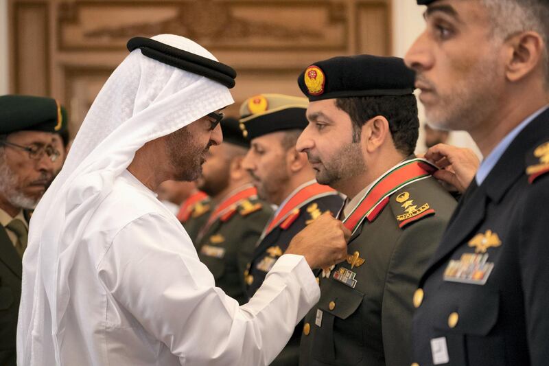 ABU DHABI, UNITED ARAB EMIRATES - April 08, 2019: HH Sheikh Mohamed bin Zayed Al Nahyan, Crown Prince of Abu Dhabi and Deputy Supreme Commander of the UAE Armed Forces (L), presents an Emirates Military Medals to members of the UAE Armed Forces, Ministry of Interior and Abu Dhabi Police, during a Sea Palace barza.

( Ryan Carter / Ministry of Presidential Affairs )
---
