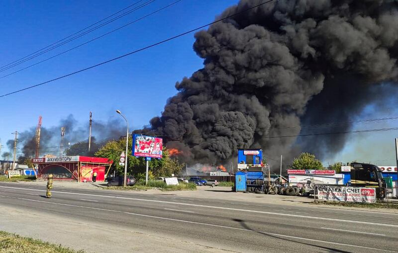 epa09270534 A handout picture provided by the Russian Emergency Ministry shows the fire at a Yevrogaz fuel filling station in Novosibirsk, Russia, 14 June 2021. Sixteen people were injured in the incident of the blaze covering an area of 800 square meters.  EPA/RUSSIAN EMERGENCIES MINISTRY HANDOUT  HANDOUT EDITORIAL USE ONLY/NO SALES