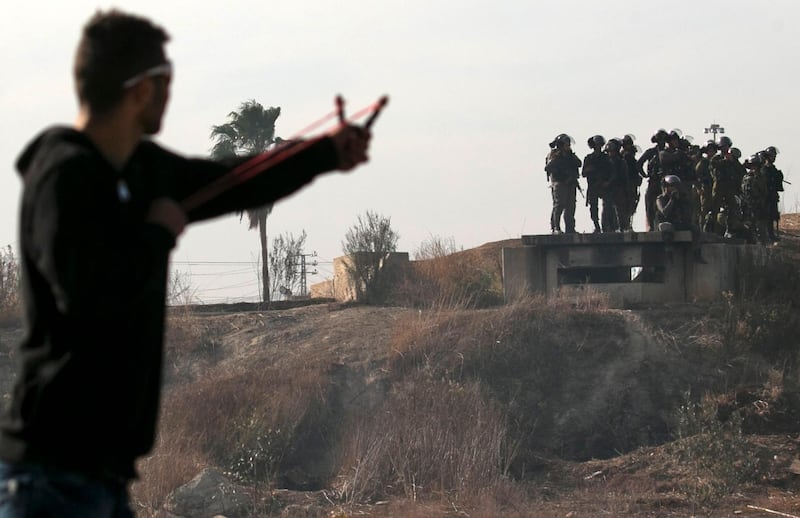 Palestinian protestors clash with Israeli security forces in the West Bank town of Tulkarem, following a demonstration against US president Donald Trump's decision to recognise Jerusalem as the capital of Israel. Jaafar Ashtiyeh / AFP Photo