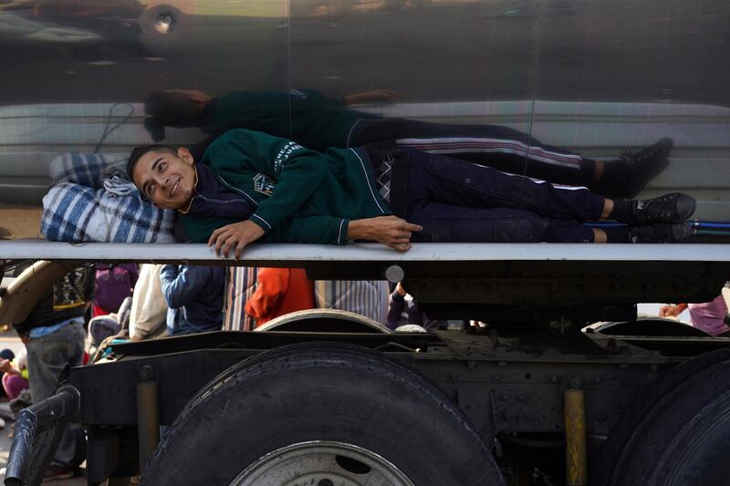 A migrant rests on a truck as he makes his way to Irapuato from Queretaro, Mexico. Reuters