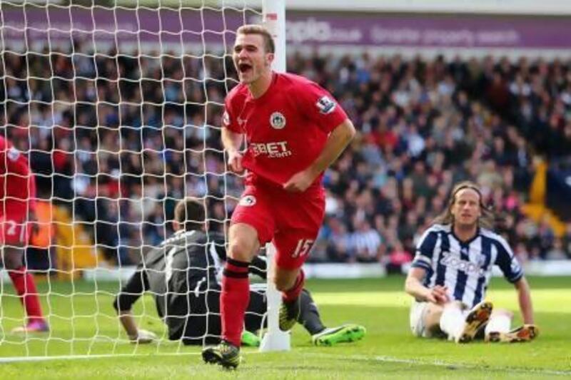 Callum McManaman celebrates his winning goal for Wigan Athletic.