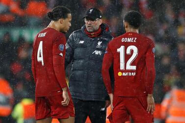 Soccer Football - Champions League - Round of 16 Second Leg - Liverpool v Atletico Madrid - Anfield, Liverpool, Britain - March 11, 2020 Liverpool manager Juergen Klopp gives instructions to Virgil van Dijk and Joe Gomez during the break before extra time REUTERS/Phil Noble