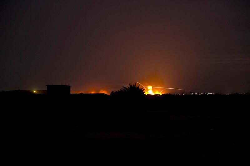 Tracer fire and explosions lights up the night sky as U.S.-backed Syrian Democratic Forces (SDF) fire on Baghouz, Syria, Sunday, March 10, 2019. (AP Photo/Maya Alleruzzo)