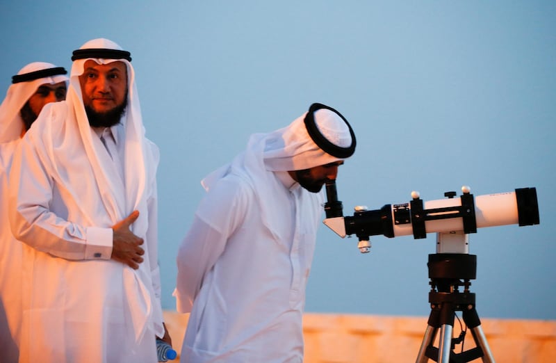 Men gather to sight the new crescent moon for the holy month of Ramadan during sandy weather at the peak of mount of Hafeet in Al-Ain, United Arab Emirates, 05 May 2019. Muslims around the world celebrate the holy month of Ramadan by praying during the night time and abstaining from eating, drinking, and sexual acts during the period between sunrise and sunset. Ramadan is the ninth month in the Islamic calendar and it is believed that the revelation of the first verse in Koran was during its last 10 nights.  EPA