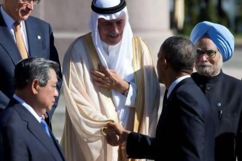 Barack Obama, second right, shakes hands with Saudi Arabia's finance minister Ibrahim Al Assaf in St Petersburg, Russia, on Friday. Alexander Zemlianichenko / AP Photo
