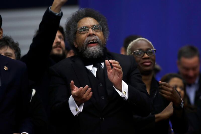Cornel West listens to Democratic presidential candidate Sen. Bernie Sanders, I-Vt., speak to supporters at a primary night election rally in Manchester, N.H. AP Photo