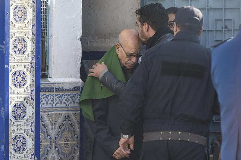 A relative kisses the head of Algerian war veteran Lakhdar Bouregaa upon his release in Algiers. AFP