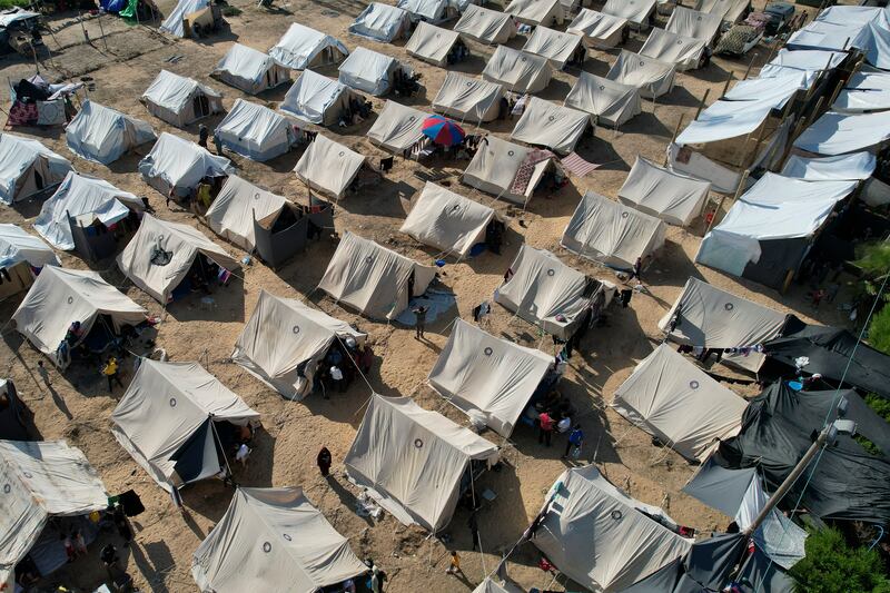 Tents provided by the UN – to house Palestinians displaced by the Israeli bombardment of Gaza – dot the landscape in Khan Younis. AP