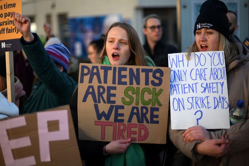 Health workers on the picket line outside St Thomas' Hospital in London. AFP