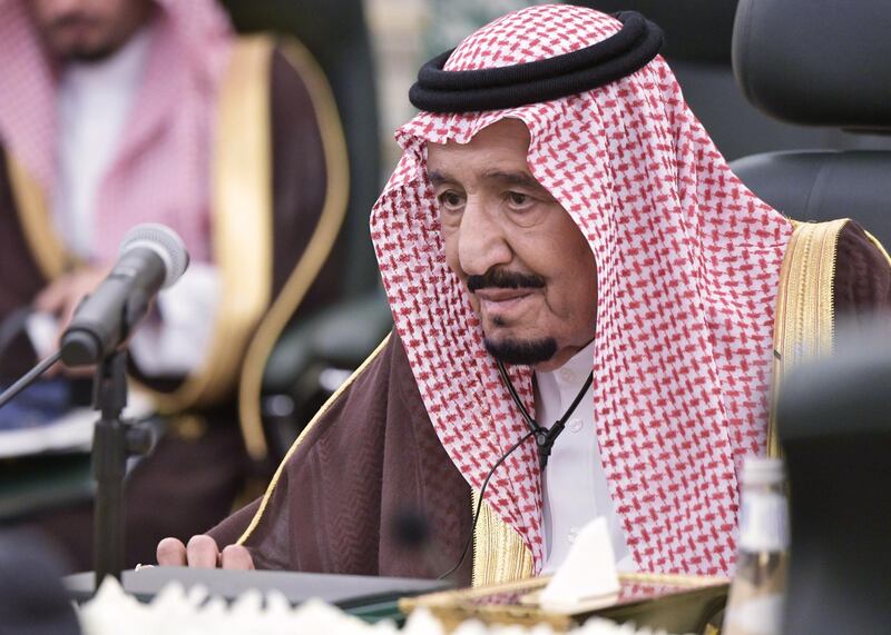 King Salman attends a meeting with Mr Putin at the Saudi Royal Palace. EPA