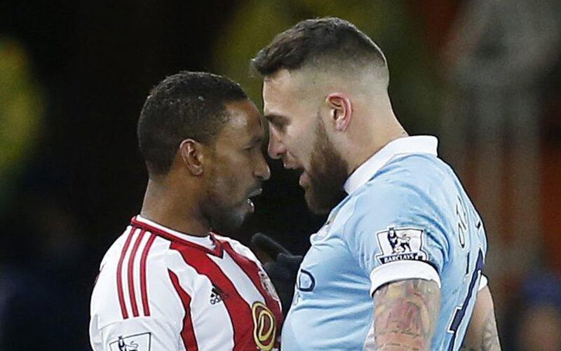 Manchester City’s Nicolas Otamendi and Sunderland’s Jermain Defoe argue during their Premier League contest. Andrew Yates / Reuters