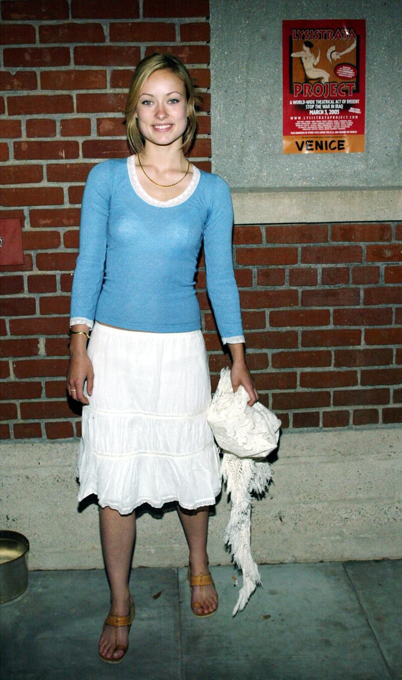 Actress and director Olivia Wilde, in a white skirt and blue sweater, attends the Lysistrata Project theatre event on March 3, 2003 in Venice, California.