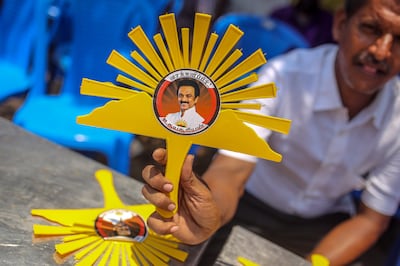 A sign featuring the logo for the Dravida Munnetra Kazhagam (DMK) party near a polling station during the first phase of voting for national elections in Chennai, Tamil Nadu, India, on Friday, April 19, 2024.  (Bloomberg)