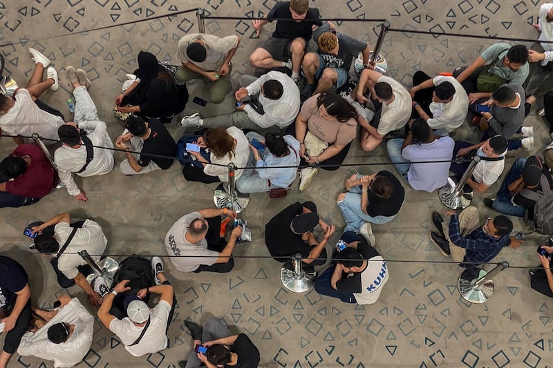 People queue for the iPhone 15 at Mall of the Emirates in Dubai. Antonie Robertson / The National