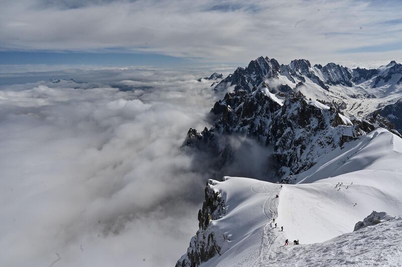 Mountaineers ski to the Vallee Blanche, a glacial valley located in the Mont-Blanc massif, from the Aiguille du Midi peak in Chamonix, France. AFP