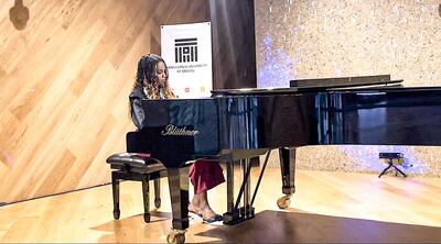 Sahar Abdulla Rasheed, a pianist who performed at Expo 2020 Dubai, was awarded for making more than 50 trips to the world's fair. Photo: Sahar Abdulla Rasheed