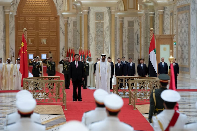 ABU DHABI, UNITED ARAB EMIRATES - July 20, 2018: HH Sheikh Mohamed bin Zayed Al Nahyan Crown Prince of Abu Dhabi Deputy Supreme Commander of the UAE Armed Forces (Centre R) and HE Xi Jinping, President of China (Centre L), stand for the UAE national anthem during a reception at the Presidential Palace. 

( Hamad Al Kaabi / Crown Prince Court - Abu Dhabi )
---