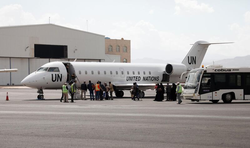 Yemenis board a United Nation plane at Sanaa International airport, Yemen. AP Photo