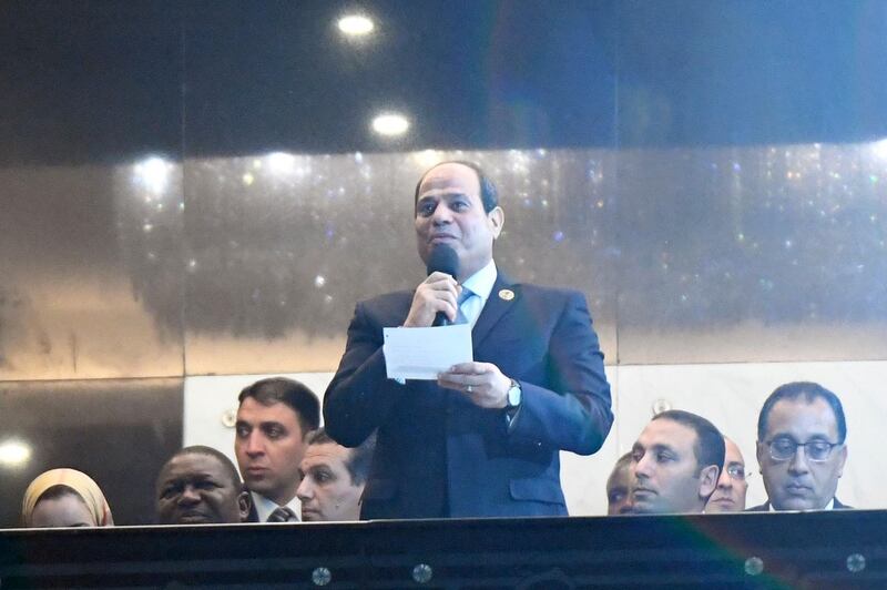 Egypt's President Abdel Fattah al-Sisi (C) delivers a speech during the opening ceremony during the 2019 Africa Cup of Nations (CAN) football match between Egypt and Zimbabwe at Cairo International Stadium on June 21, 2019.  / AFP / Khaled DESOUKI
